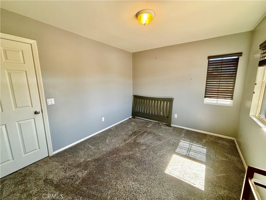 1005 Garrett Way San Jacinto, CA 92583 - Photo 18 of 29 a view of an empty room with a window