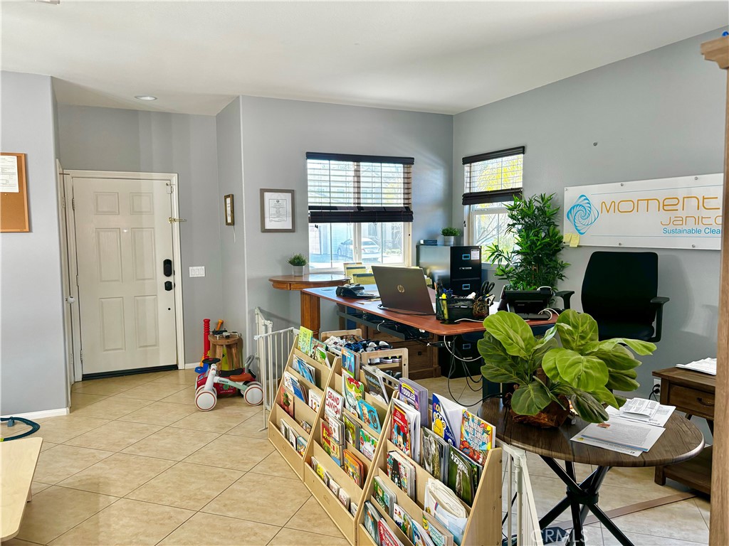 1005 Garrett Way San Jacinto, CA 92583 - Photo 4 of 29 a living room with furniture and a flat screen tv