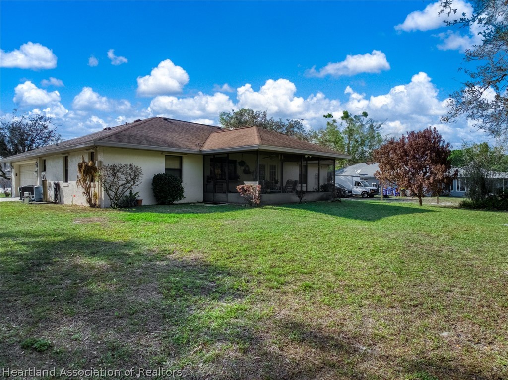 5802 Golden Road Sebring, FL 33875 - Photo 28 of 37 a view of a house with yard and a garden