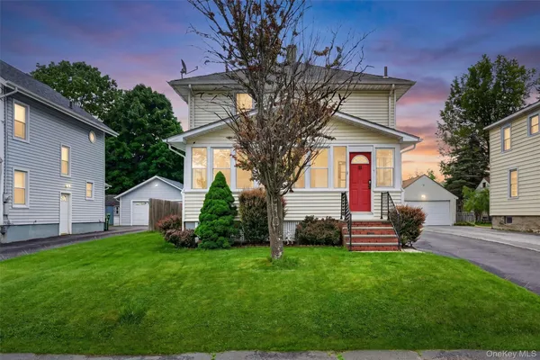 a view of a house with a yard