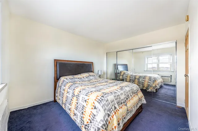 a bedroom with bed and window