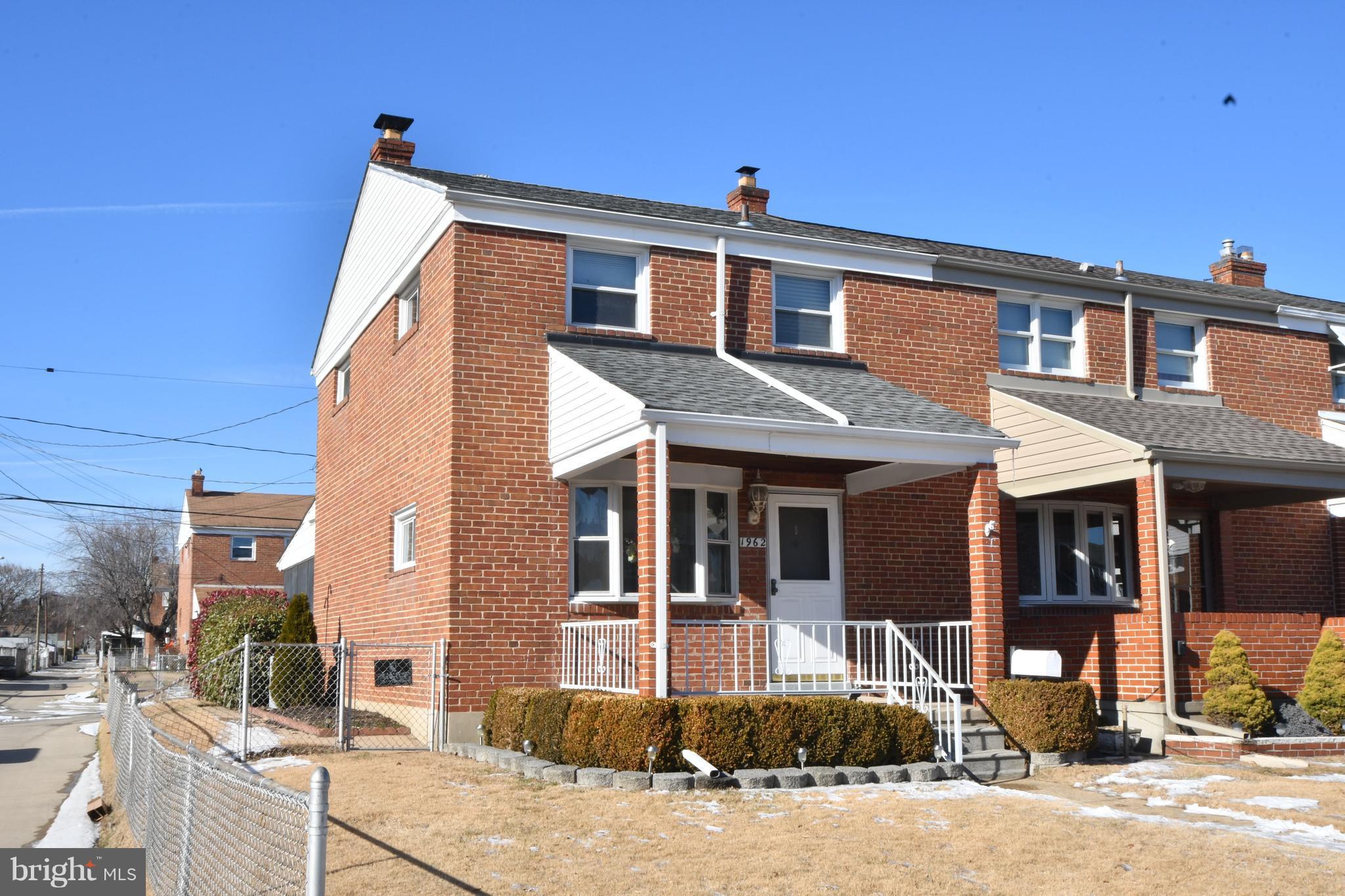 1962 Holborn Road Baltimore, MD 21222 - Photo 1 of 30 a front view of a house with a yard