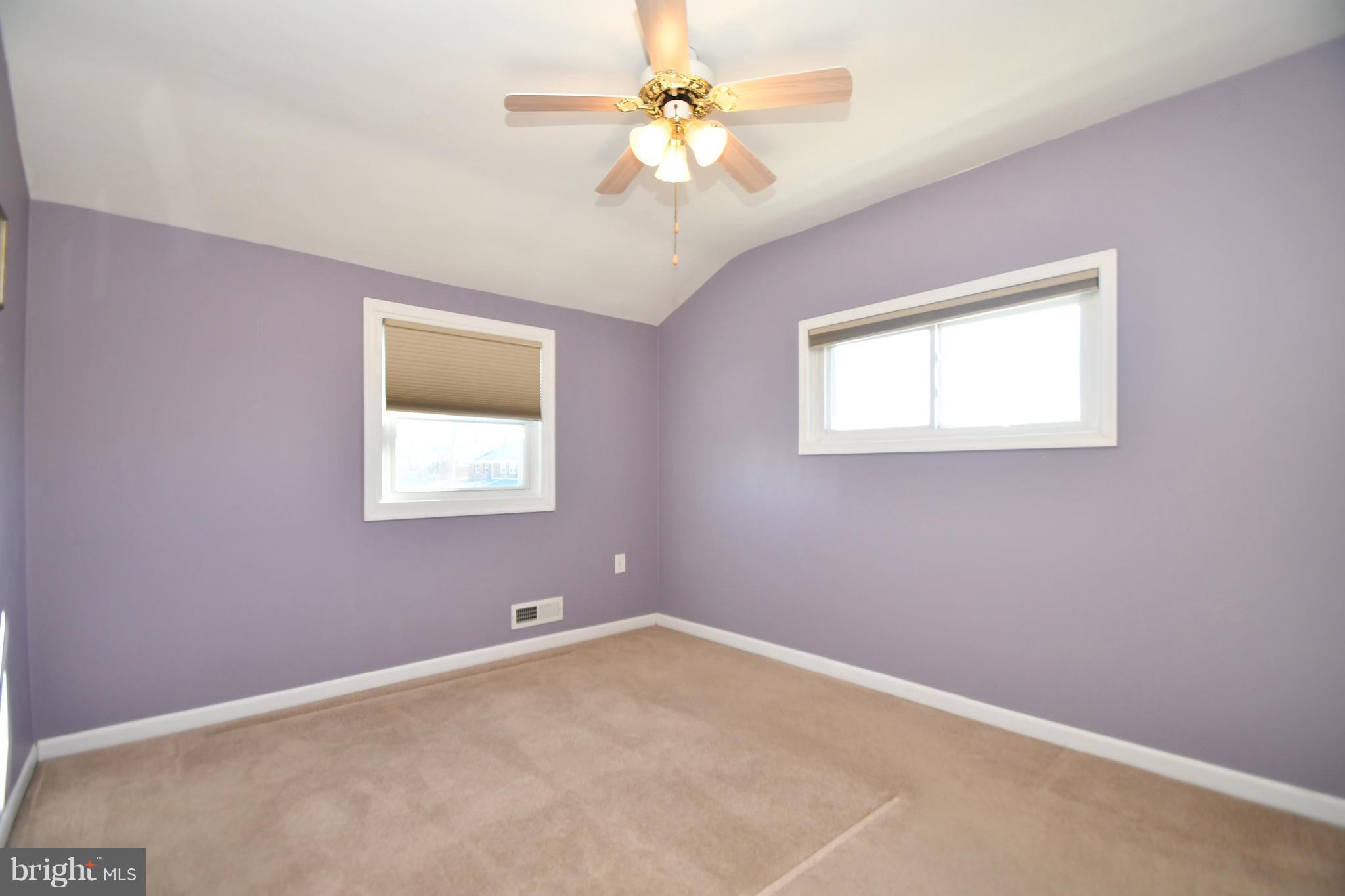 1962 Holborn Road Baltimore, MD 21222 - Photo 14 of 30 an empty room with a window and a fan