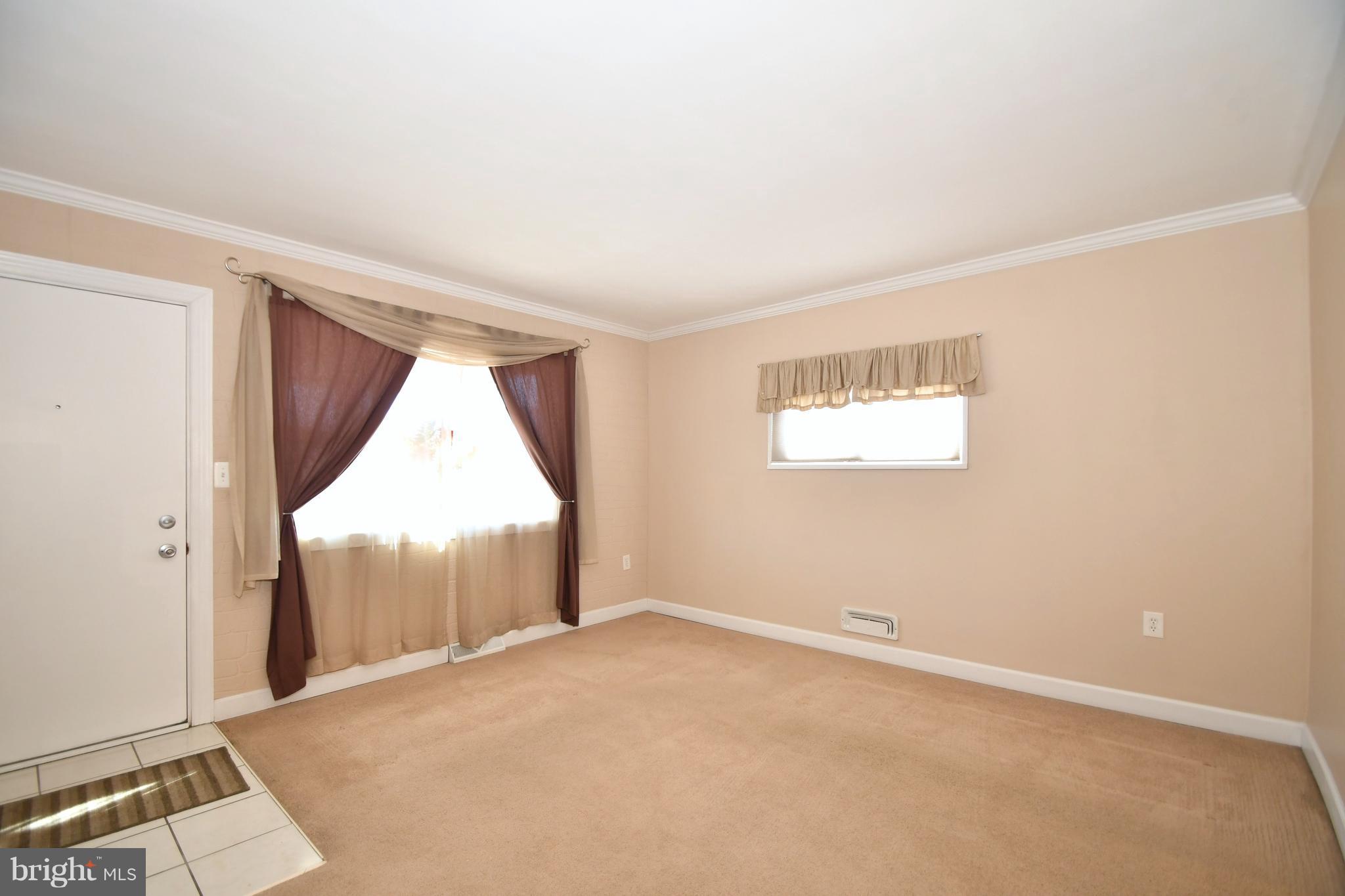 1962 Holborn Road Baltimore, MD 21222 - Photo 4 of 30 an empty room with windows and closet