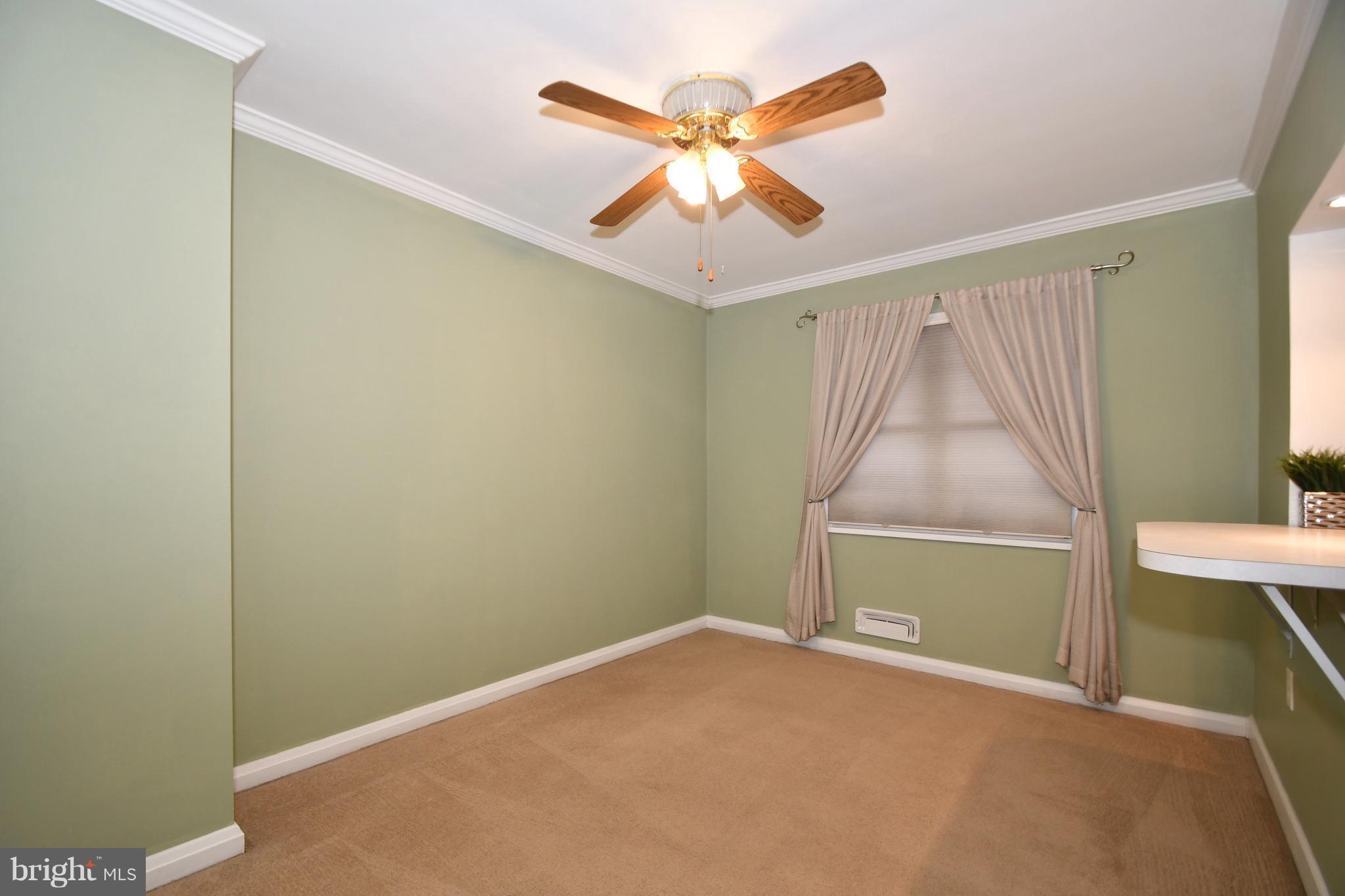 1962 Holborn Road Baltimore, MD 21222 - Photo 8 of 30 an empty room with closet and fan