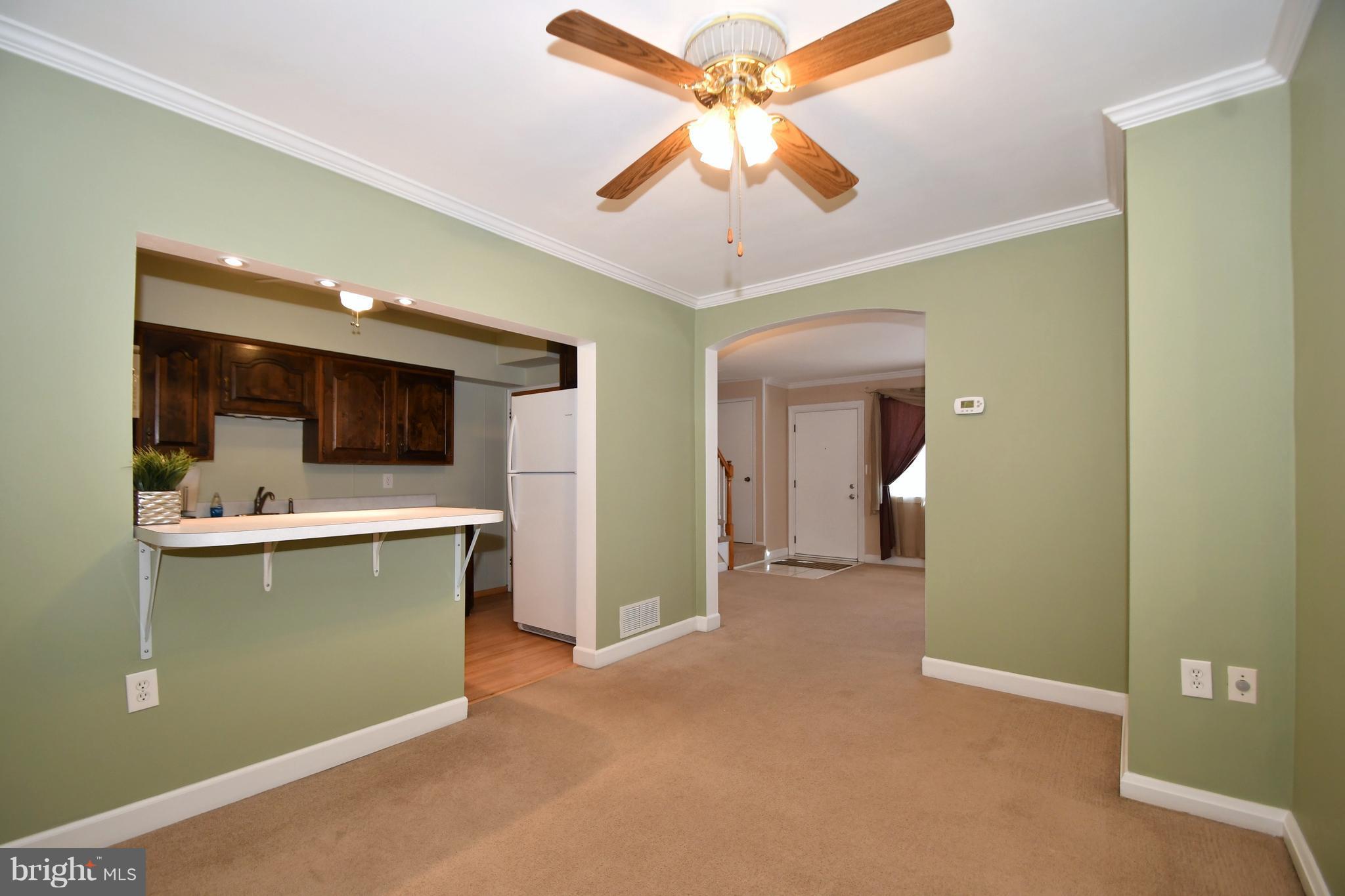 1962 Holborn Road Baltimore, MD 21222 - Photo 10 of 30 a view of a kitchen with a sink cabinets and a ceiling fan