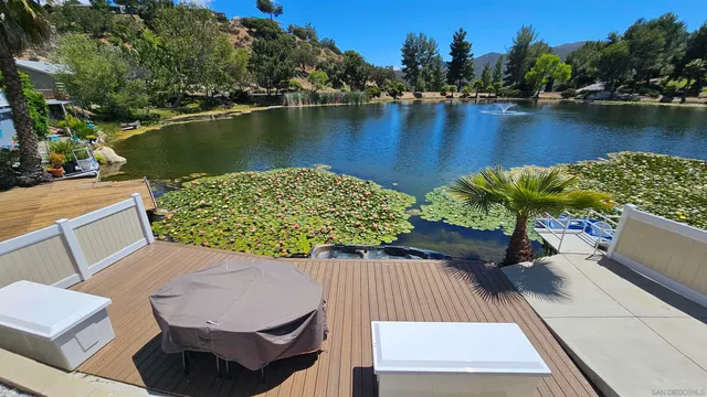 an aerial view of a house with a lake view