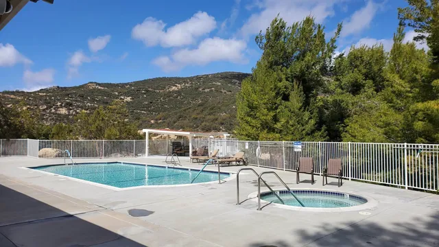 a view of a lake with houses in the back