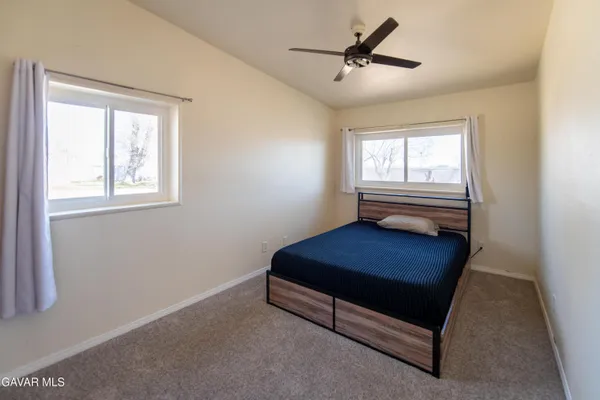 a living room with furniture and windows
