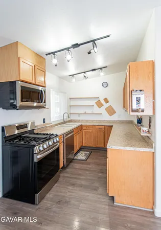 a kitchen with a stove and a sink