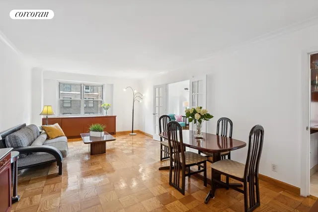 a dining room with furniture and wooden floor