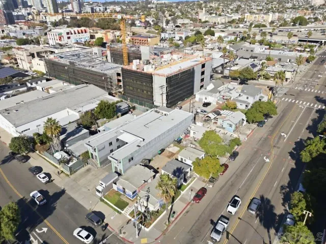 an aerial view of residential houses with outdoor space