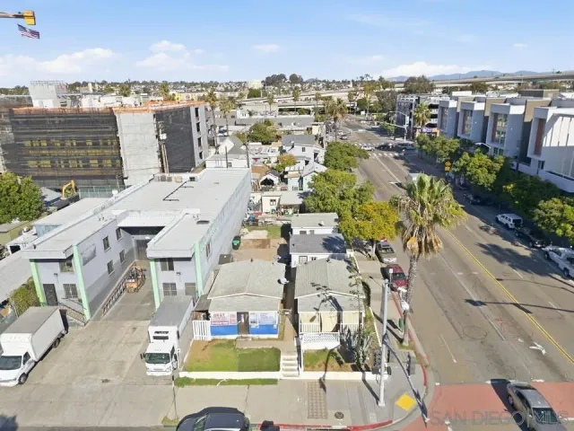 a view of a street with a building in the background