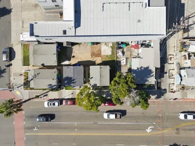 an aerial view of residential houses with outdoor space