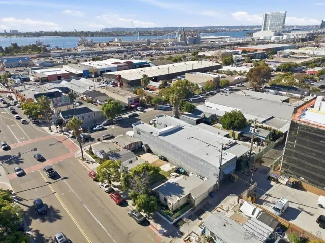 a view of a city and lake with lots of trees