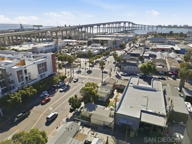 an aerial view of a house with a garden and lake view