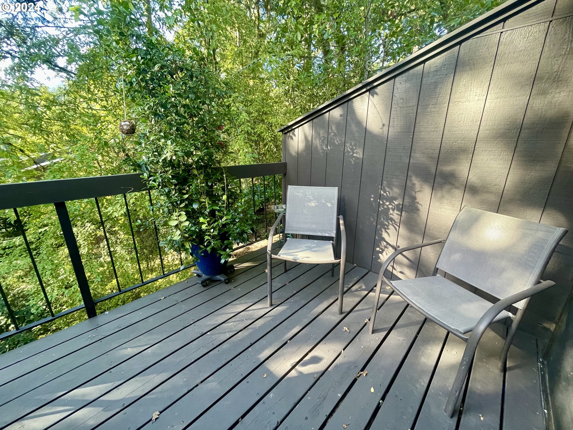 132 Brae Burn Drive Eugene, OR 97405 - Photo 12 of 42 a balcony with wooden floor table and chairs