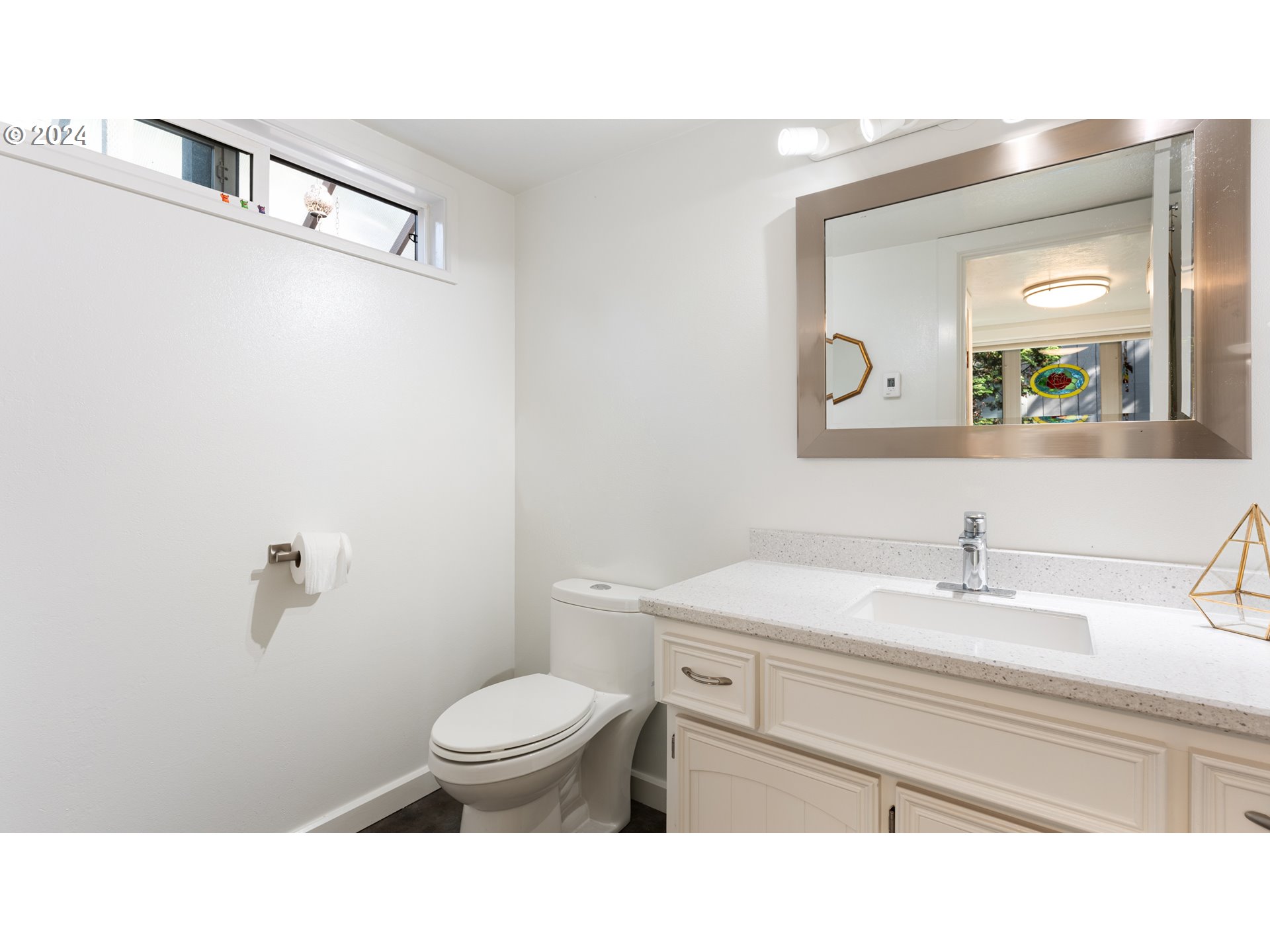 132 Brae Burn Drive Eugene, OR 97405 - Photo 22 of 42 a bathroom with a sink a toilet and a mirror