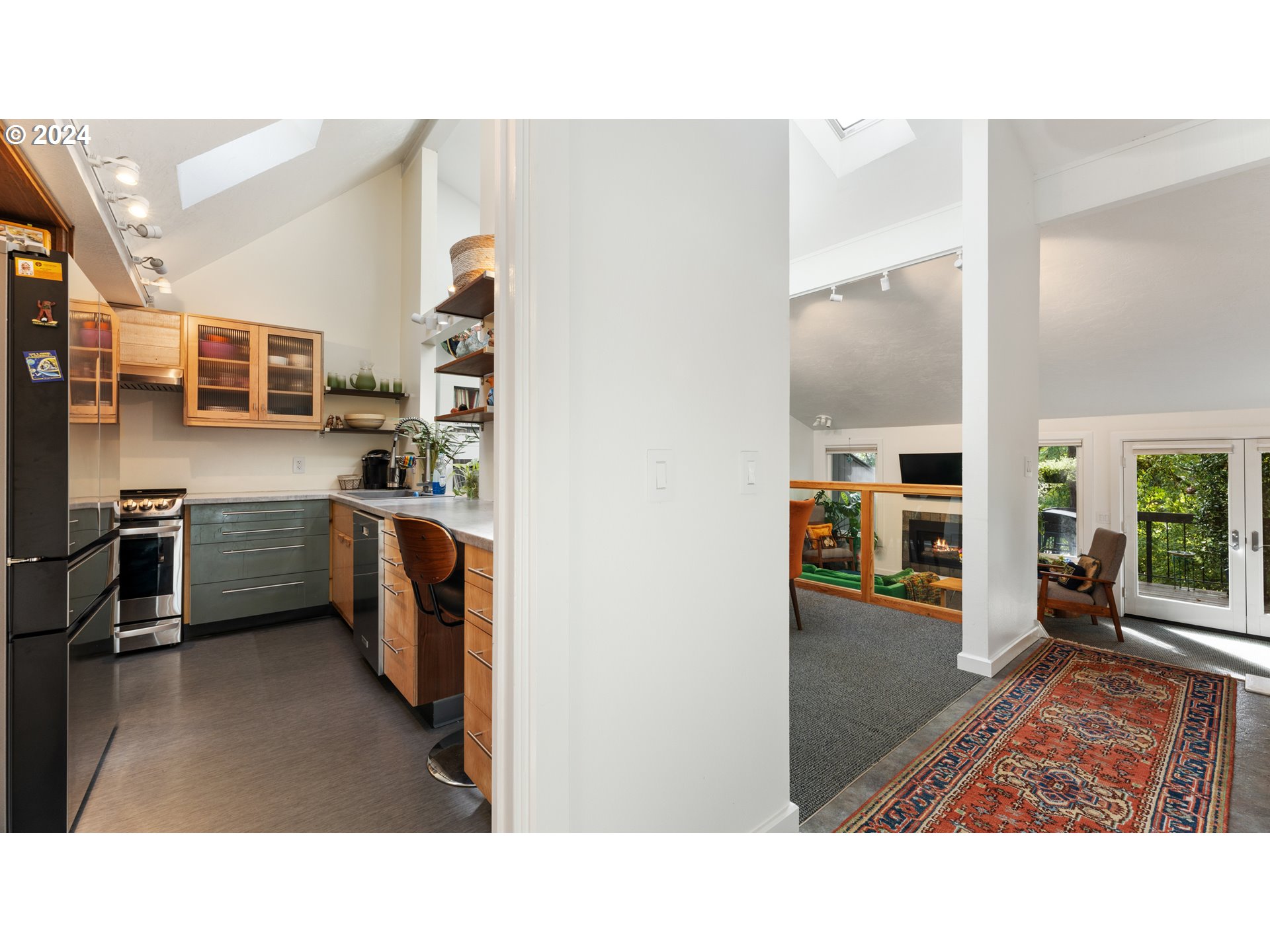 132 Brae Burn Drive Eugene, OR 97405 - Photo 5 of 42 a open kitchen with stainless steel appliances kitchen island granite countertop a sink and cabinets