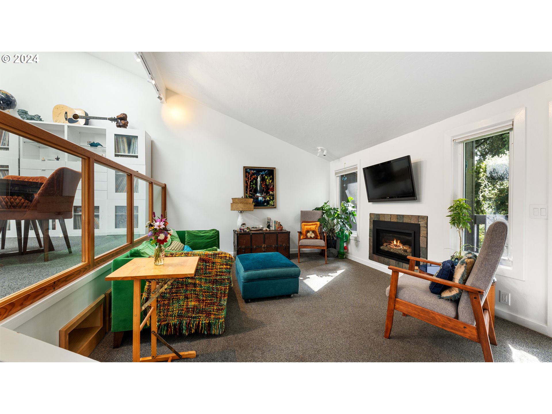 132 Brae Burn Drive Eugene, OR 97405 - Photo 8 of 42 a living room with furniture a fireplace and a flat screen tv