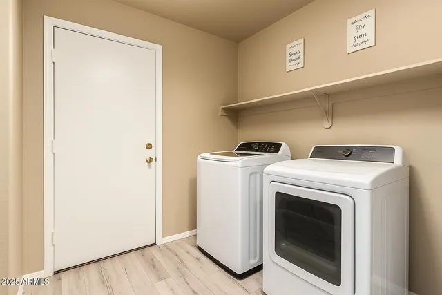 a utility room with dryer and washer