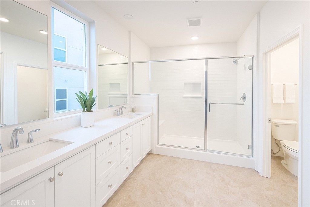 349 Proctor Irvine, CA 92618 - Photo 9 of 14 a bathroom with a double vanity sink and mirror
