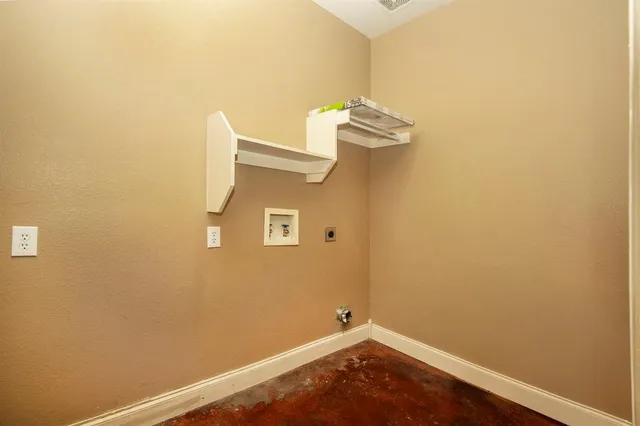 a view of a small space with wooden floor