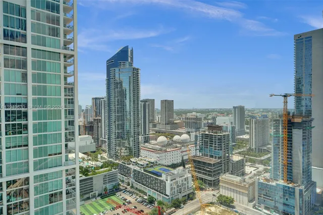 a view of city with tall buildings