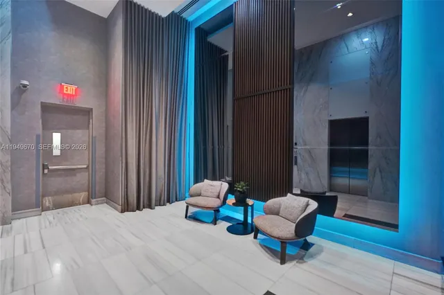 a bedroom with a bed and a chair