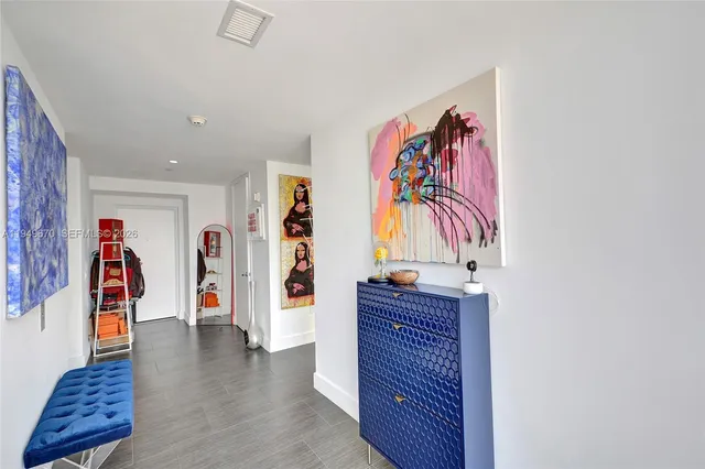 a view of a workspace with furniture and closet