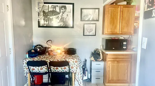 a table with a fireplace and two windows