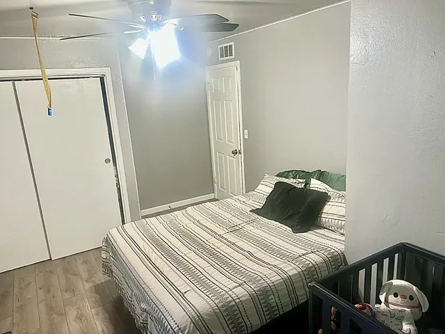 a bedroom with a bed and a mirror