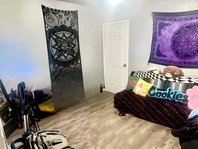 a bed room with furniture and decor