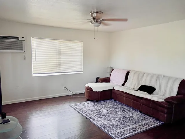 a living room with furniture and a rug
