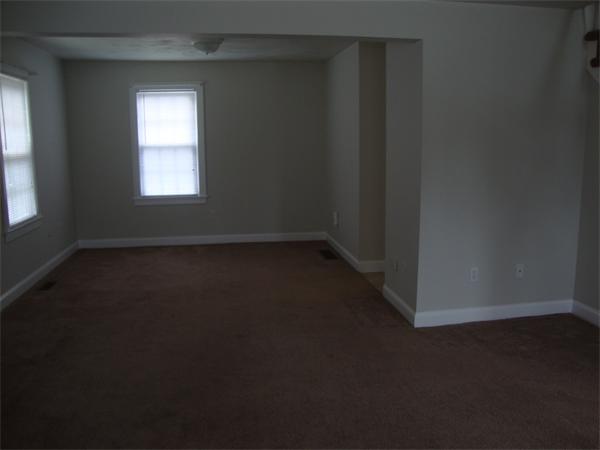 1156 Main Street Acushnet, MA 02743 - Photo 8 of 16 an empty room with a window