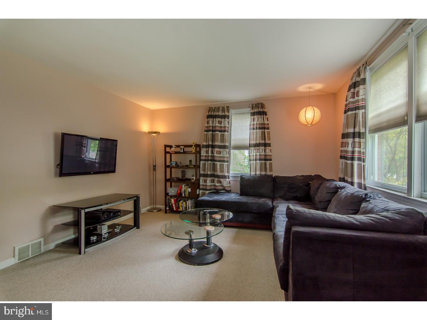 473 Harwicke Road Springfield, PA 19064 - Photo 3 of 25 a living room with furniture and a flat screen tv
