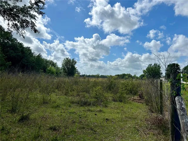 a view of a lake with green space