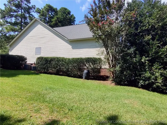 a view of a backyard of the house