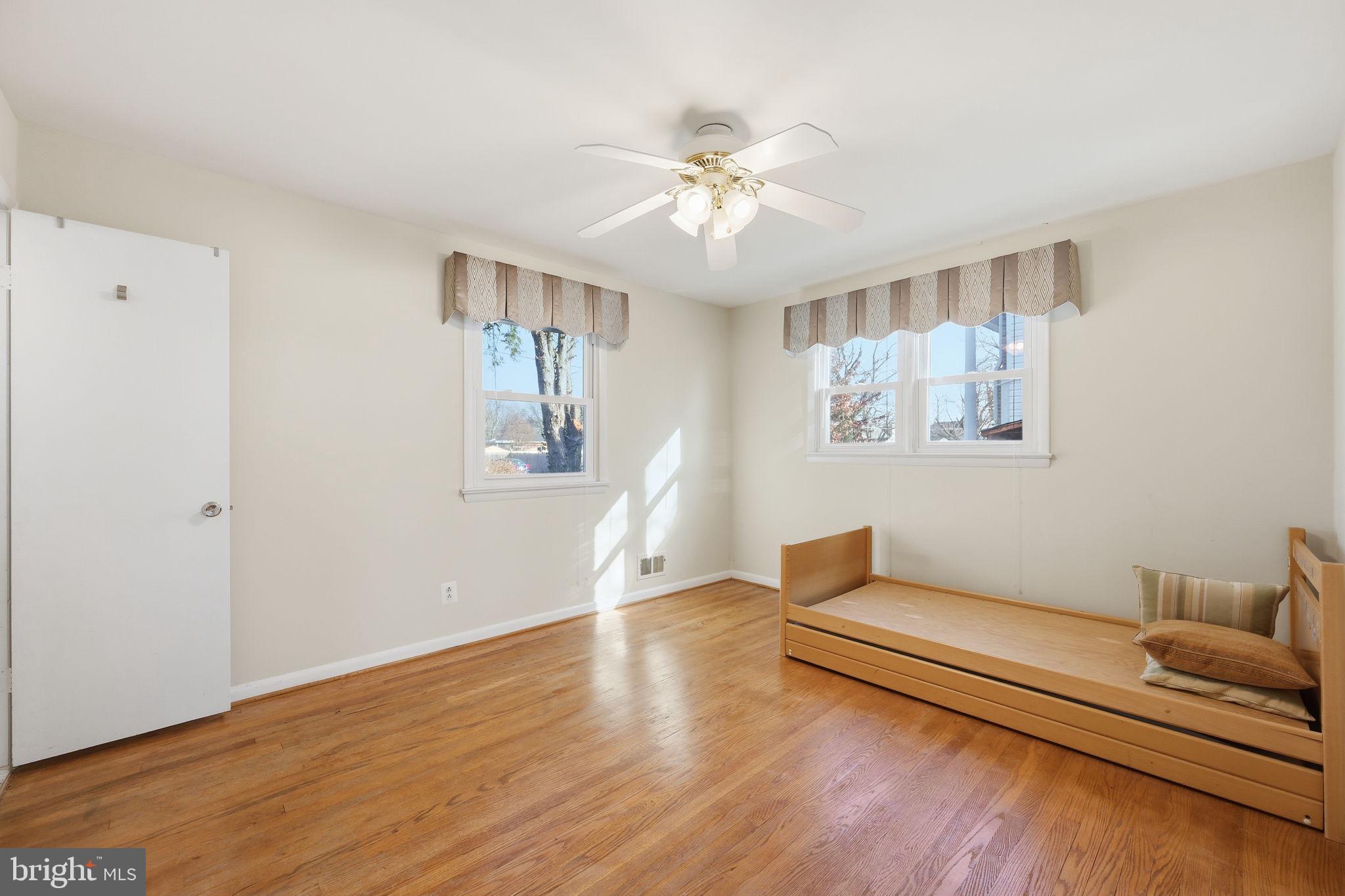 1721 University Boulevard West Silver Spring, MD 20902 - Photo 17 of 38 a living room with furniture and a wooden floor