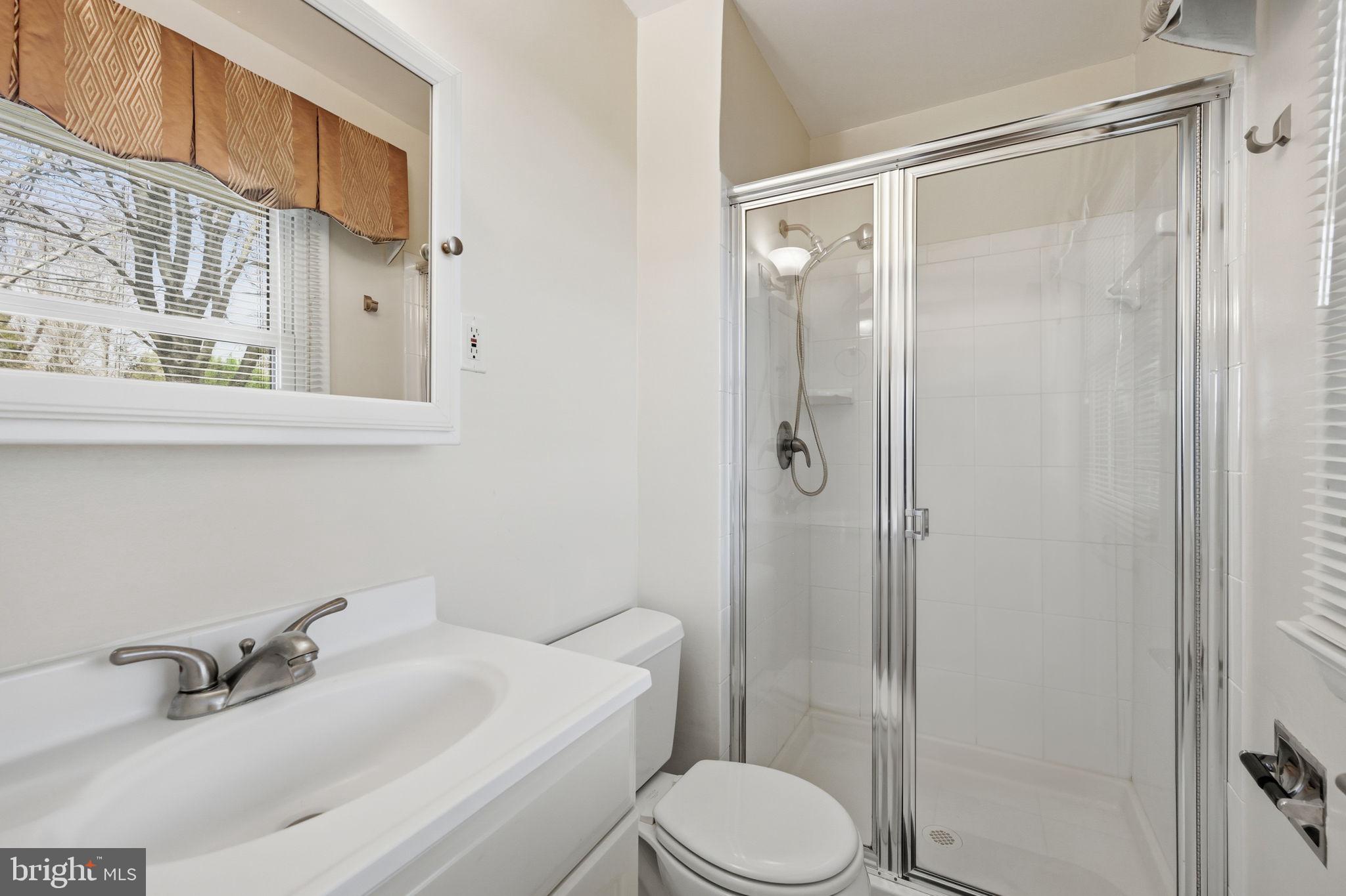 1721 University Boulevard West Silver Spring, MD 20902 - Photo 20 of 38 a bathroom with a sink toilet and shower