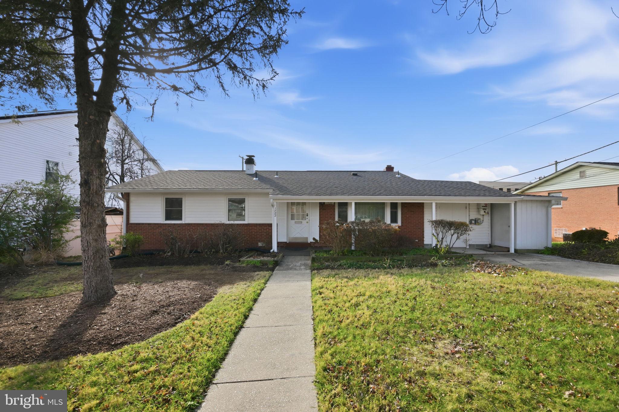 1721 University Boulevard West Silver Spring, MD 20902 - Photo 2 of 38 a front view of a house with garden