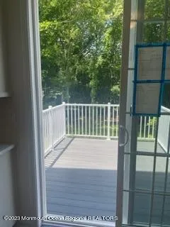 a view of balcony with yard