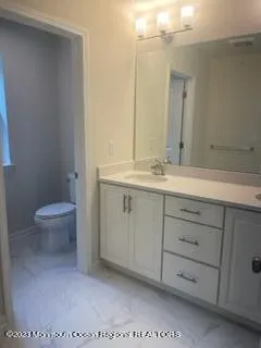 a bathroom with a glass shower door