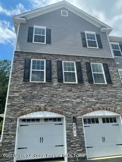 a front view of a building with brick walls
