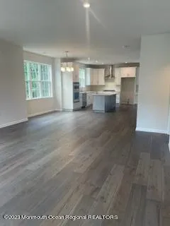 a kitchen with a sink cabinets and window