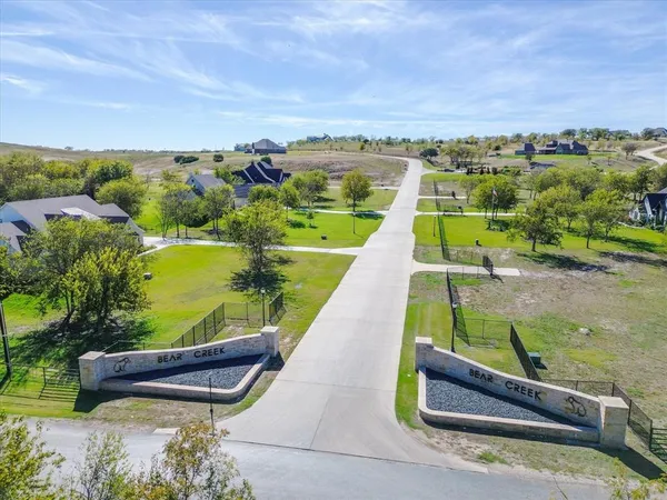 an aerial view of a house with a swimming pool
