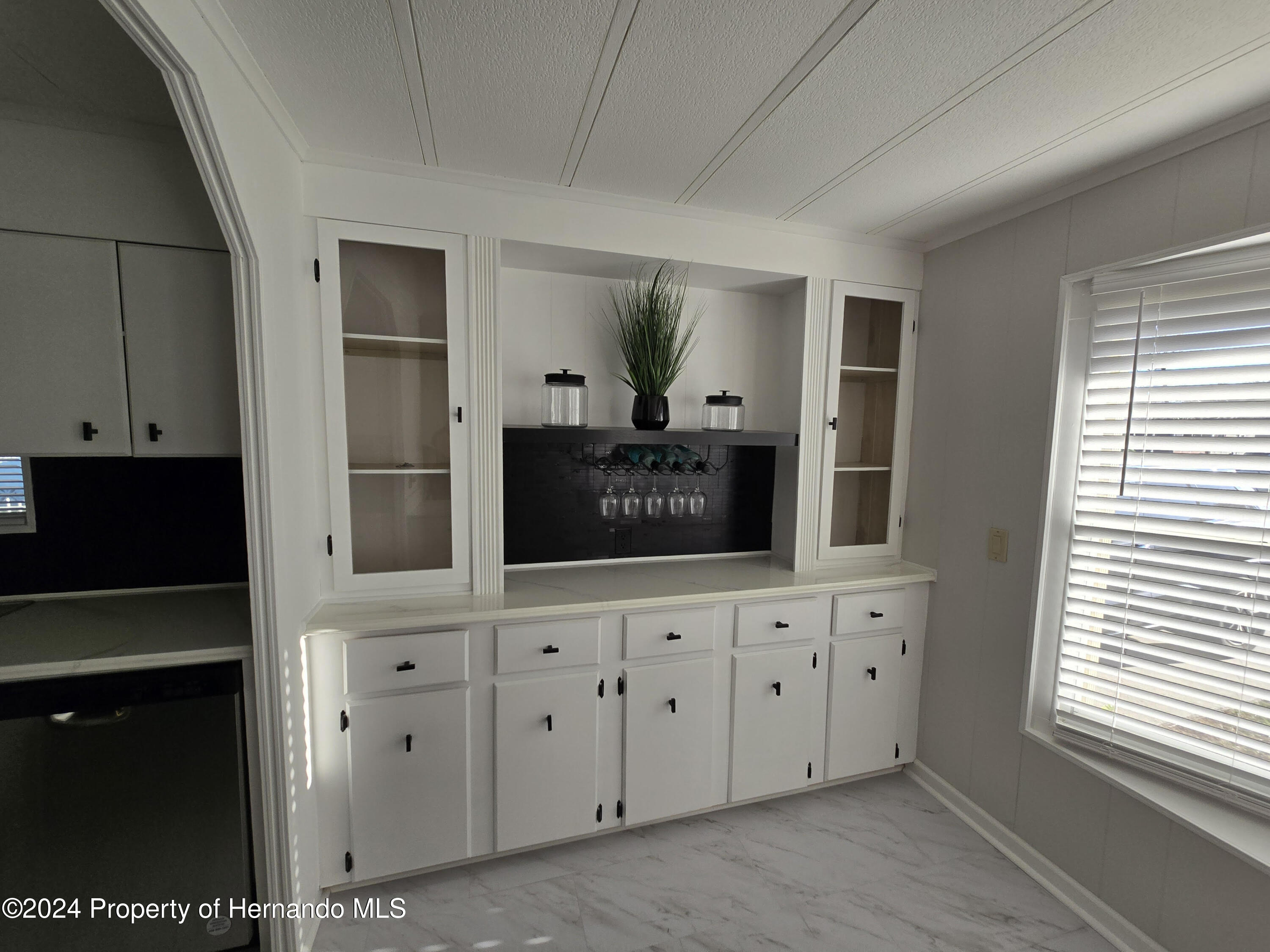 15260 Brookridge Boulevard Brooksville, FL 34613 - Photo 14 of 56 a living room with window