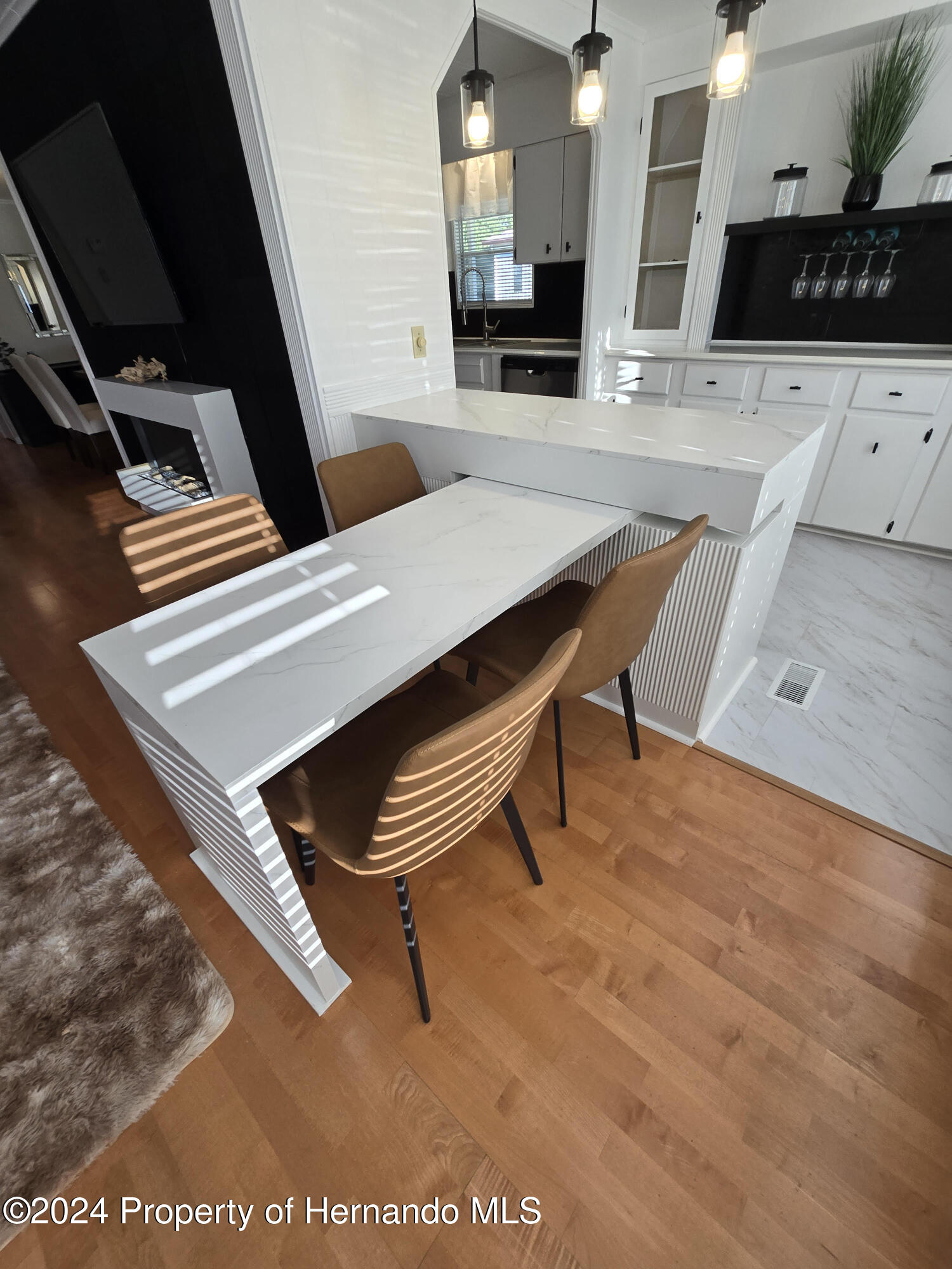 15260 Brookridge Boulevard Brooksville, FL 34613 - Photo 16 of 56 a living room with furniture and a flat screen tv