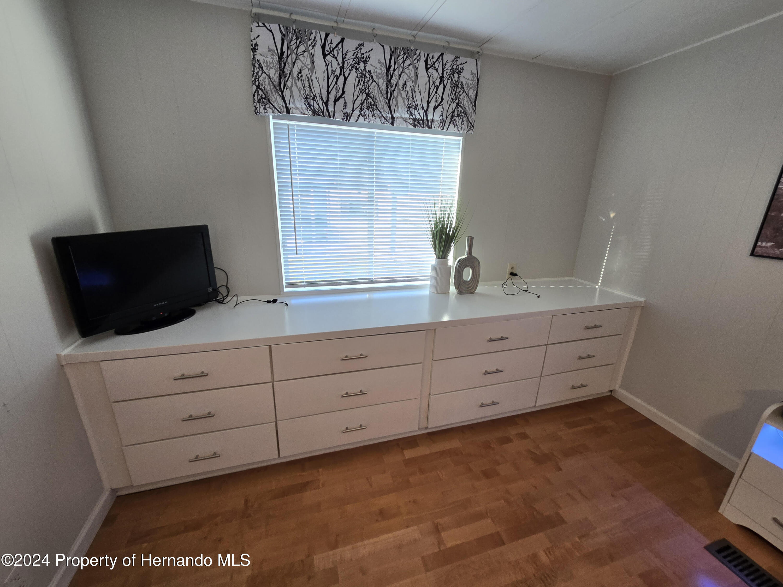 15260 Brookridge Boulevard Brooksville, FL 34613 - Photo 36 of 56 a bathroom with a sink and a mirror