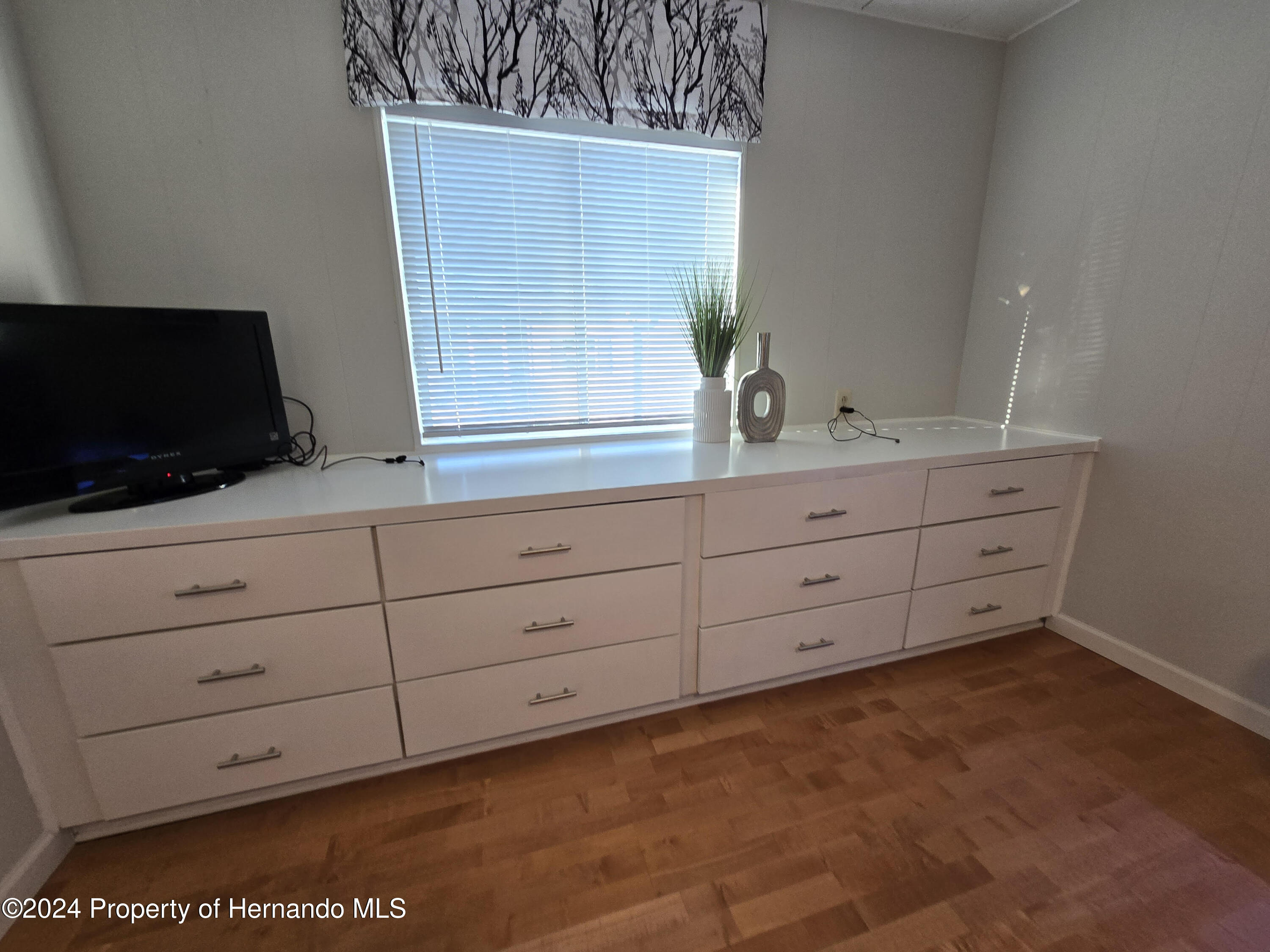 15260 Brookridge Boulevard Brooksville, FL 34613 - Photo 37 of 56 a bathroom with a sink and a mirror